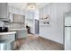 A charming kitchen with gray cabinets, stainless steel appliances, and modern mosaic backsplash at 912 Harlan St, Indianapolis, IN 46203