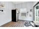 A kitchen area featuring a stainless steel refrigerator and a window with natural light at 912 Harlan St, Indianapolis, IN 46203
