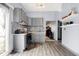 Well-lit kitchen with gray cabinets, stainless steel appliances, and a sliding glass door to the patio at 912 Harlan St, Indianapolis, IN 46203