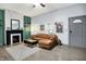 Spacious living room with a modern sofa, gray floors, and a stylish rug at 912 Harlan St, Indianapolis, IN 46203