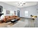 Open living area featuring a leather sofa, gray floors, and plenty of natural light at 912 Harlan St, Indianapolis, IN 46203