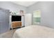 A comfortable bedroom featuring a modern TV cabinet and a soft white bed at 912 Harlan St, Indianapolis, IN 46203