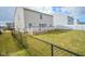 Spacious backyard with a deck and fence, offering outdoor living and privacy at 10708 Inspiration Dr, Indianapolis, IN 46259