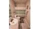 Cozy bathroom featuring a neutral color palette, shower with curtain, and modern fixtures at 10708 Inspiration Dr, Indianapolis, IN 46259