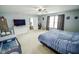 Bedroom with a large bed, and a door to the bathroom at 10708 Inspiration Dr, Indianapolis, IN 46259