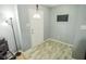 An inviting entryway featuring neutral walls, a bright white door, and modern lighting at 10708 Inspiration Dr, Indianapolis, IN 46259