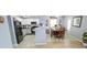 Spacious kitchen featuring updated appliances, white cabinetry, and an adjacent dining area at 10708 Inspiration Dr, Indianapolis, IN 46259