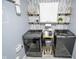 Convenient laundry room featuring modern appliances, decorative shelves and stylish accents for an organized space at 10708 Inspiration Dr, Indianapolis, IN 46259
