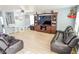 Spacious living room with stylish furniture, light wood floors, and ample natural light at 10708 Inspiration Dr, Indianapolis, IN 46259