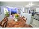 Open layout connects kitchen to living room with dining table and large fish tank at 10708 Inspiration Dr, Indianapolis, IN 46259
