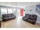 Bright living room featuring comfortable seating, neutral walls, and a view of the home's entryway at 10708 Inspiration Dr, Indianapolis, IN 46259