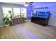 Living room features a modern fish tank, recessed lighting, and natural light from the windows at 10708 Inspiration Dr, Indianapolis, IN 46259