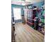 Storage room features wood-look flooring and built in storage shelves at 10708 Inspiration Dr, Indianapolis, IN 46259