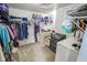 Well-organized walk-in closet with clothing racks and storage shelves at 10708 Inspiration Dr, Indianapolis, IN 46259