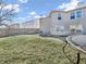 Spacious backyard featuring a well-maintained lawn, wooden fence, and trampoline at 10830 Clear Spring Dr, Camby, IN 46113