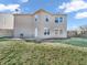 A spacious backyard features a deck, green lawn, and fenced perimeter for privacy at 10830 Clear Spring Dr, Camby, IN 46113