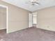 A neutral bedroom provides a doorway to a closet and another living space at 10830 Clear Spring Dr, Camby, IN 46113