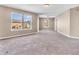 Spacious bedroom with neutral walls, carpet flooring and bright windows at 10830 Clear Spring Dr, Camby, IN 46113