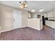 A bright dining area features dark wood floors, an overhead light fixture, and access to the kitchen at 10830 Clear Spring Dr, Camby, IN 46113