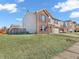 Two-story home featuring a brick facade, siding, well-manicured lawn, and attached garage at 10830 Clear Spring Dr, Camby, IN 46113