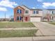 A charming two-story home features brick accents, a well-manicured lawn, and an attached garage at 10830 Clear Spring Dr, Camby, IN 46113