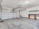 A spacious two-car garage with room for storage and a workbench at 10830 Clear Spring Dr, Camby, IN 46113
