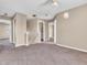 A spacious living room with carpet, a ceiling fan, and plenty of natural light at 10830 Clear Spring Dr, Camby, IN 46113