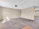 Spacious living room with neutral walls, carpeting, and natural light creates a warm and inviting atmosphere at 10830 Clear Spring Dr, Camby, IN 46113