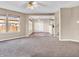 Open living room with neutral walls, fan, carpet, and great natural lighting at 10830 Clear Spring Dr, Camby, IN 46113