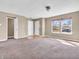 Living room with neutral walls, carpeting, and abundant natural light creates a warm and inviting space at 10830 Clear Spring Dr, Camby, IN 46113