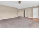 Cozy living room with neutral paint, carpeting, and ample natural light at 10830 Clear Spring Dr, Camby, IN 46113