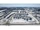Aerial view of a neighborhood featuring single-Gathering homes and streets with surrounding snow at 10865 Mystic View Ct, Indianapolis, IN 46239
