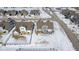 Aerial view of homes in a suburban neighborhood during winter, with snow-covered yards at 10865 Mystic View Ct, Indianapolis, IN 46239
