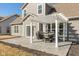 The back patio features a modern pergola shading an outdoor dining set, perfect for entertaining and relaxation at 10865 Mystic View Ct, Indianapolis, IN 46239