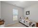 Cozy bedroom showcasing a twin bed, window and carpeted floor at 10865 Mystic View Ct, Indianapolis, IN 46239