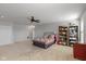 Spacious bedroom with neutral walls, plush carpet, ceiling fan, and ample space for relaxation and personalization at 10865 Mystic View Ct, Indianapolis, IN 46239