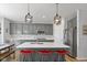 Beautiful kitchen with gray cabinets, quartz countertops, and stainless steel appliances at 10865 Mystic View Ct, Indianapolis, IN 46239