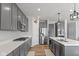Well-appointed kitchen featuring stainless steel appliances and gray cabinetry at 10865 Mystic View Ct, Indianapolis, IN 46239