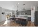 Modern kitchen with a large island, stainless steel appliances, and stylish pendant lighting at 10865 Mystic View Ct, Indianapolis, IN 46239