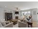 Open living room featuring a fireplace, ceiling fan, and lots of natural light at 10865 Mystic View Ct, Indianapolis, IN 46239