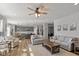 Open-concept living room with hardwood floors, gray walls, fireplace and lots of natural light at 10865 Mystic View Ct, Indianapolis, IN 46239