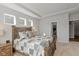 Comfortable main bedroom with a tray ceiling, a large window, carpet and neutral decor at 10865 Mystic View Ct, Indianapolis, IN 46239