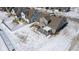 Aerial view of the rear of a home with a patio and snow covered backyard at 10865 Mystic View Ct, Indianapolis, IN 46239