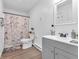Bathroom with updated vanity and sink, a framed mirror and a shower with patterned curtain at 12386 S Hillview Dr, Columbus, IN 47201