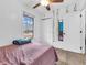 Light bedroom with a leafy vine, window, and closet at 12386 S Hillview Dr, Columbus, IN 47201