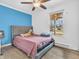 Bedroom featuring a comfortable bed with a gray headboard and a view of the outdoors at 12386 S Hillview Dr, Columbus, IN 47201