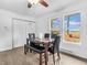 Bright dining area boasts natural light, with outdoor views from two windows at 12386 S Hillview Dr, Columbus, IN 47201