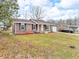 Well-maintained brick house with a green lawn, black shutters, and an attached one-car garage at 12386 S Hillview Dr, Columbus, IN 47201