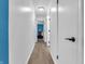 Hallway showing wood flooring and a view to another room at 12386 S Hillview Dr, Columbus, IN 47201