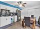 Updated kitchen features white cabinets, black tile backsplash, and stainless steel appliances at 12386 S Hillview Dr, Columbus, IN 47201